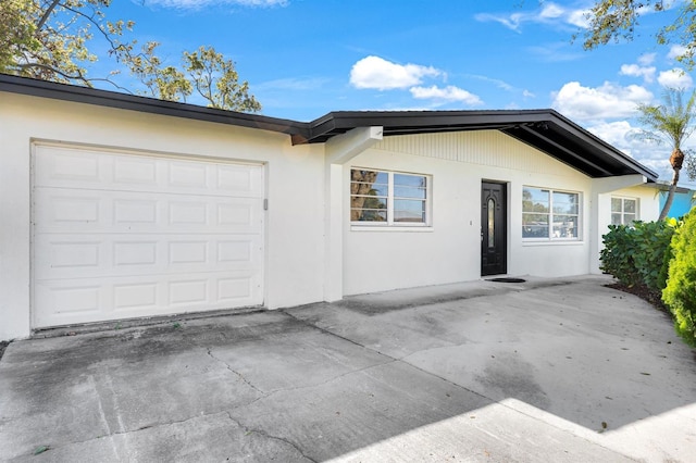 ranch-style house featuring a garage