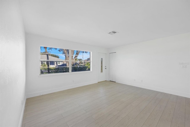 empty room with light wood-type flooring