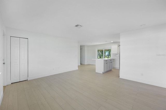 unfurnished room featuring light hardwood / wood-style floors