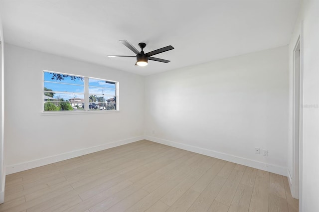 unfurnished room featuring ceiling fan and light hardwood / wood-style flooring