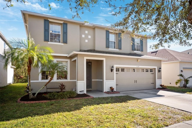 view of front of property featuring a garage and a front yard