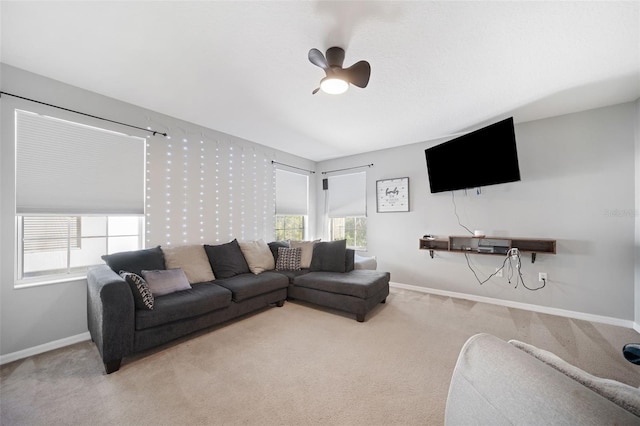 living room featuring carpet floors and ceiling fan