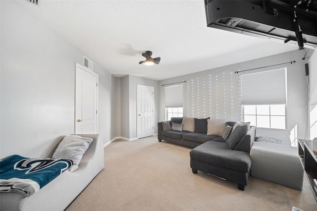 carpeted living room with a textured ceiling