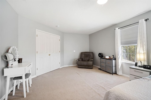 carpeted bedroom featuring a closet