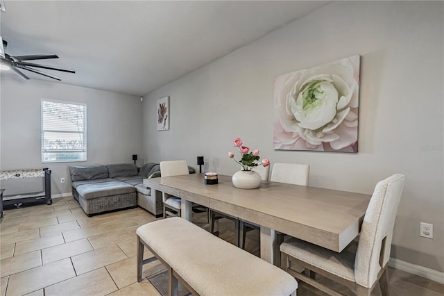 tiled dining area featuring ceiling fan