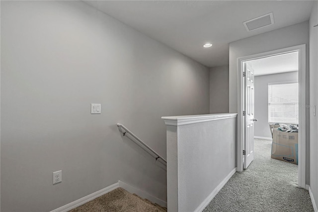 staircase with carpet floors