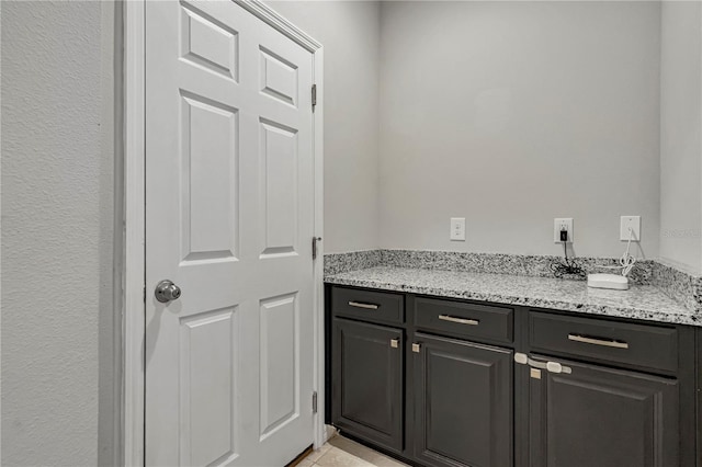 bathroom with vanity and tile patterned floors