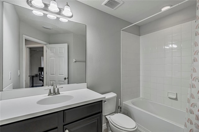 full bathroom with shower / tub combination, vanity, and toilet