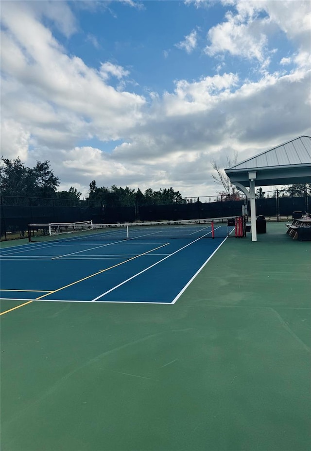 view of tennis court with a gazebo