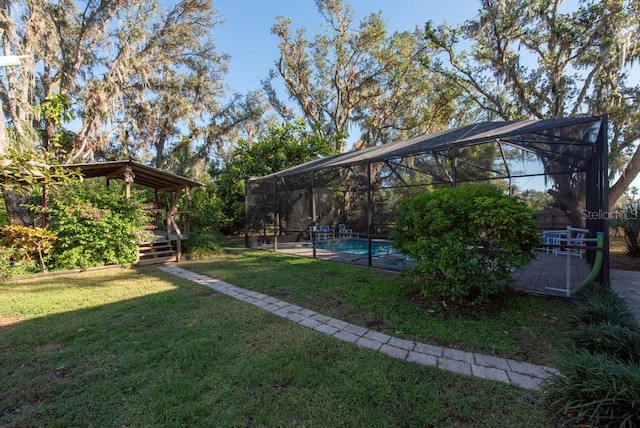 view of yard with a lanai and a pool side deck