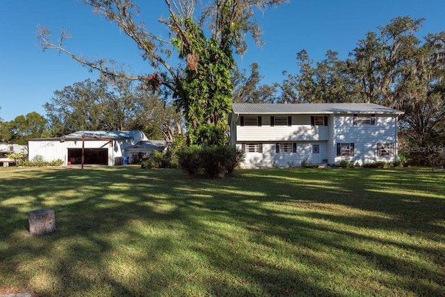 11008 Browning Rd, Lithia, FL 33547 - view of green lawn featuring an outbuilding and a garage