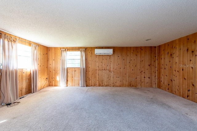 11008 Browning Rd, Lithia, FL 33547 - carpeted empty room with a textured ceiling, wood walls, and a wall mounted air conditioner