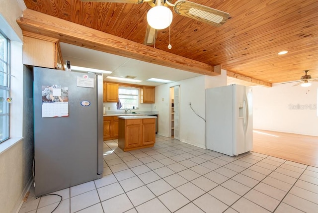 kitchen featuring stainless steel refrigerator, ceiling fan, light tile patterned floors, and white refrigerator with ice dispenser