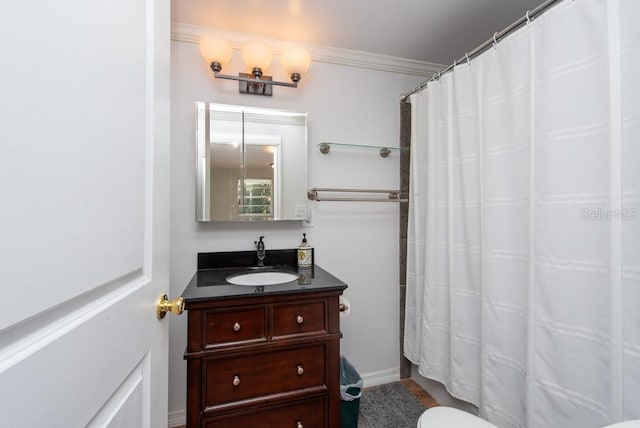 bathroom with vanity, curtained shower, toilet, and crown molding