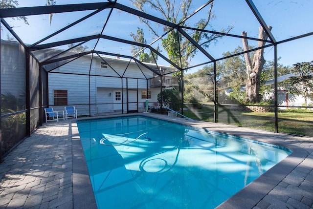 view of pool with a lanai and a patio area