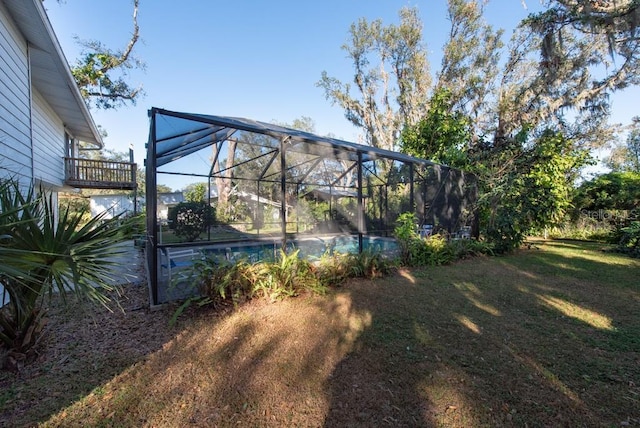 11008 Browning Rd, Lithia, FL 33547 - view of grassy yard with an outdoor pool and glass enclosure