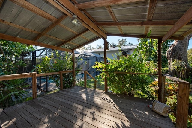 wooden terrace featuring glass enclosure