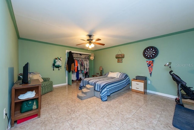 bedroom featuring ceiling fan, a closet, and crown molding