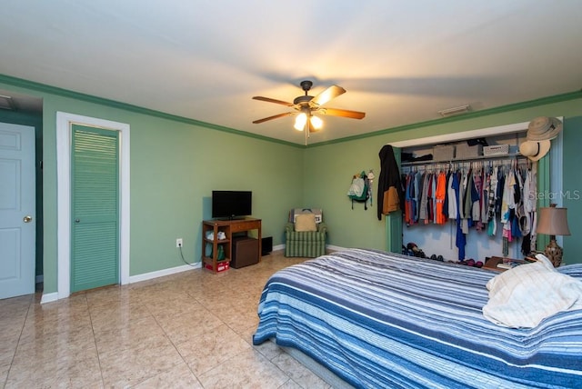 bedroom featuring a closet, ceiling fan, and crown molding