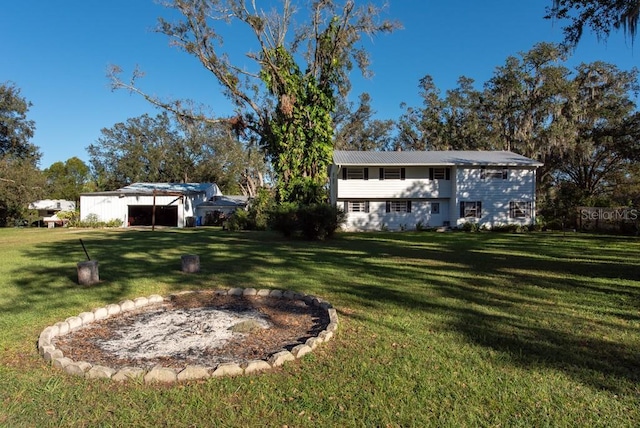 11008 Browning Rd, Lithia, FL 33547 - view of grassy yard with a detached garage