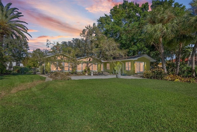 view of front of property with a lawn