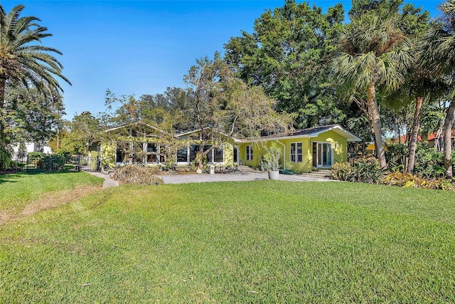 rear view of house with a lawn