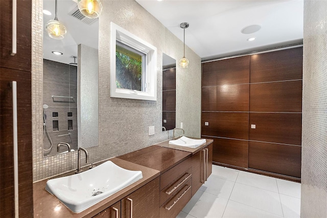 bathroom featuring tile patterned floors, vanity, and tile walls