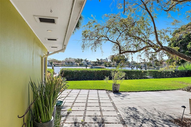 view of patio / terrace with a water view