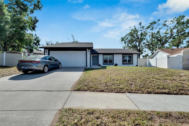 ranch-style home featuring a front lawn and a garage