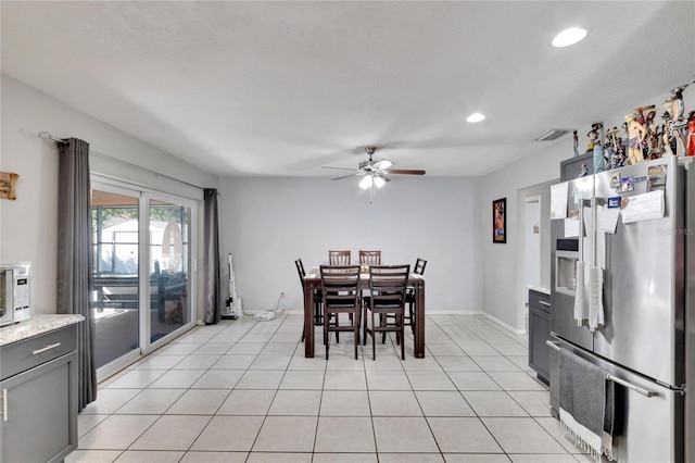 dining area featuring ceiling fan and light tile patterned flooring