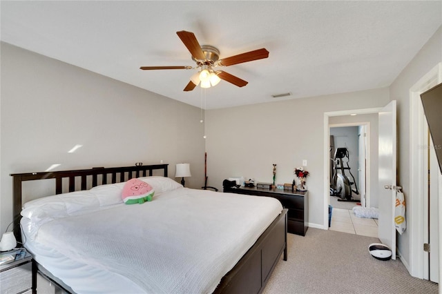 bedroom with ceiling fan and light colored carpet