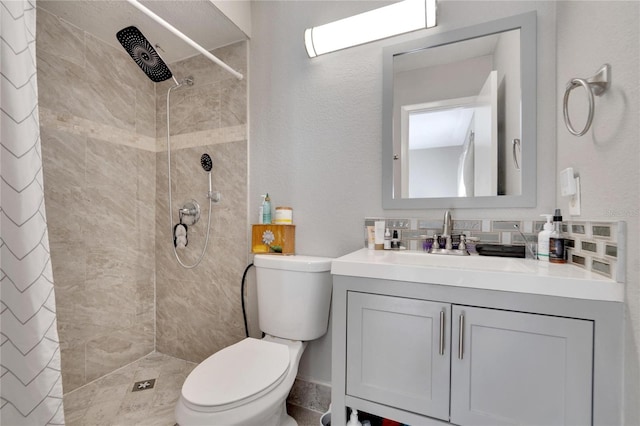 bathroom with a shower with curtain, vanity, and toilet