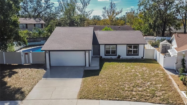 view of front of house featuring a front yard and a garage