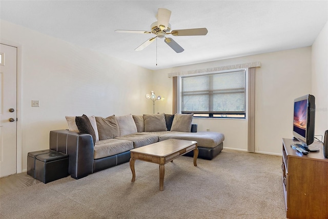 carpeted living room featuring ceiling fan