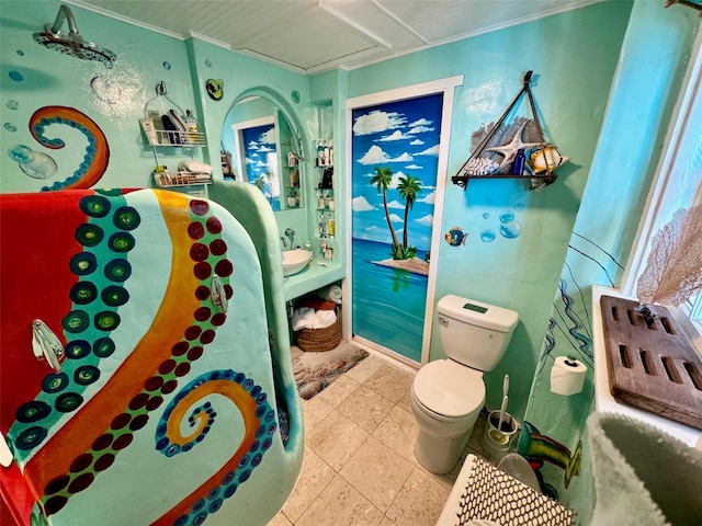 bathroom with tile patterned flooring and toilet