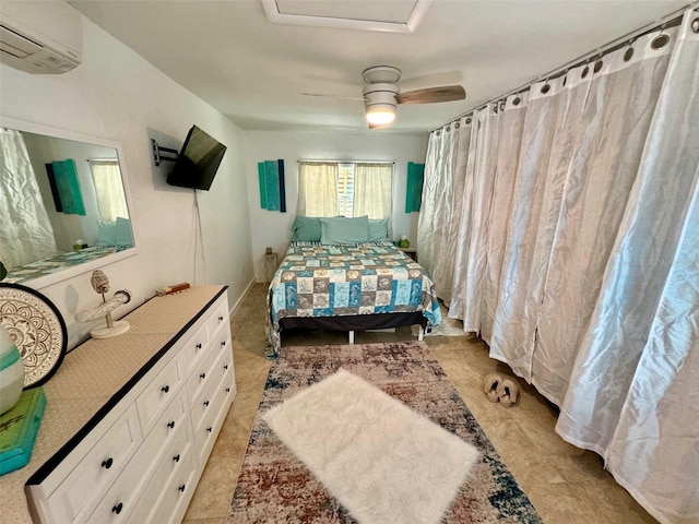 bedroom featuring ceiling fan and a wall unit AC