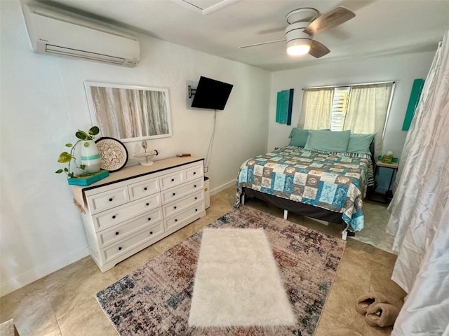 bedroom with a wall unit AC and ceiling fan