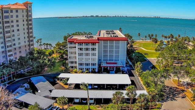 birds eye view of property with a water view