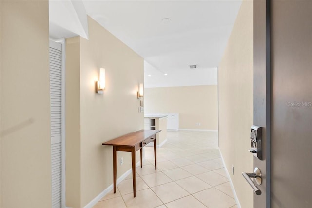 hallway with light tile patterned floors