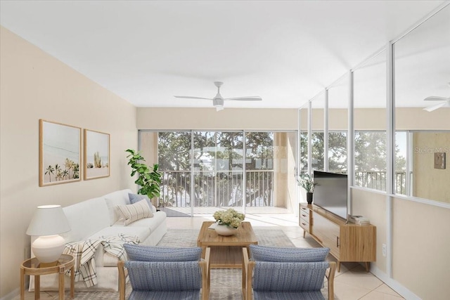 living room featuring ceiling fan and light tile patterned floors