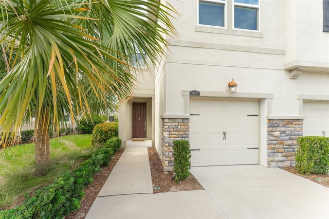 view of exterior entry with a garage