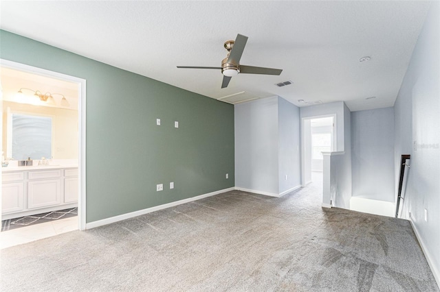 carpeted empty room with ceiling fan