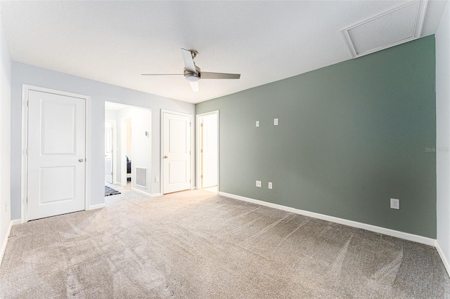 unfurnished bedroom featuring ceiling fan and carpet floors