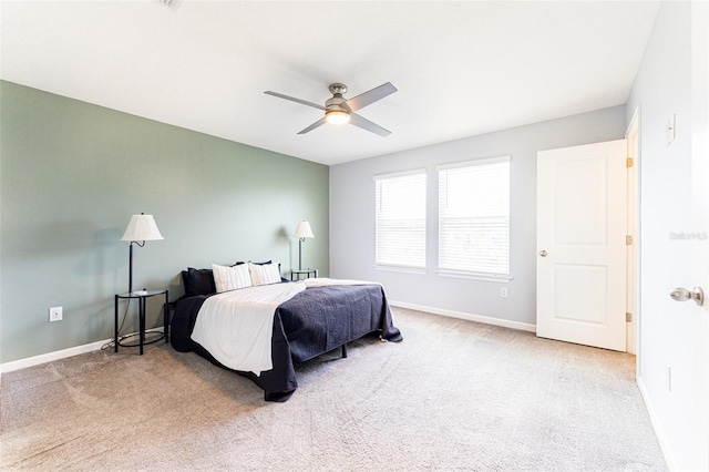 bedroom with light carpet and ceiling fan