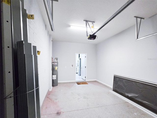 garage featuring electric water heater and a garage door opener