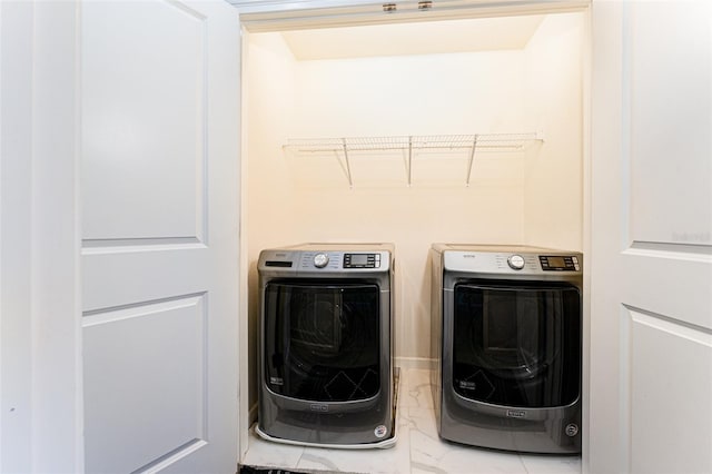 laundry room with washer and dryer