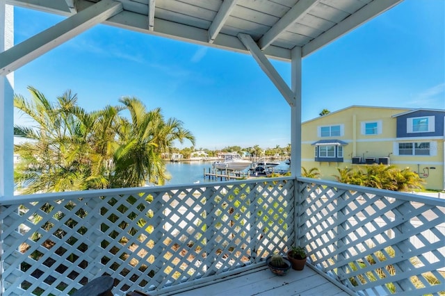 balcony featuring a water view