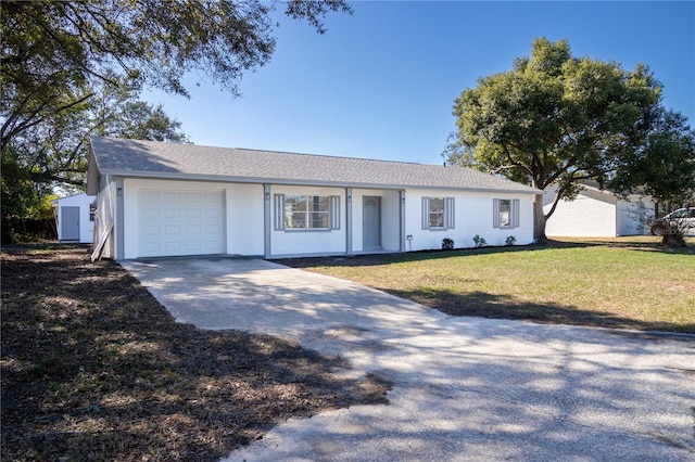 ranch-style house with a garage and a front yard