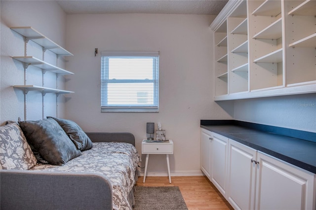 unfurnished bedroom featuring baseboards and light wood finished floors