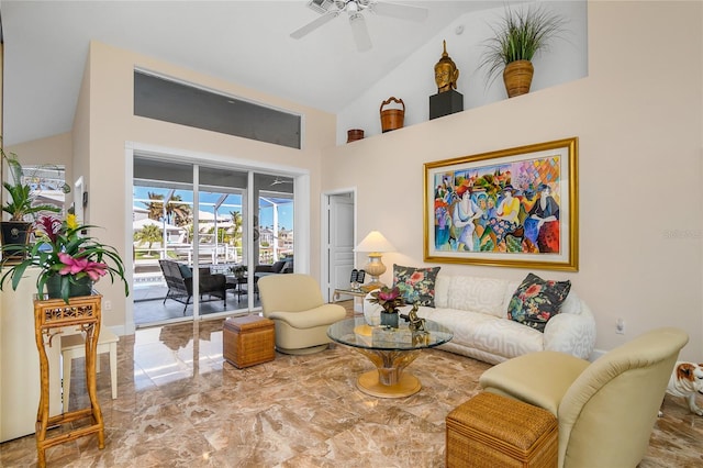 living room with high vaulted ceiling and ceiling fan